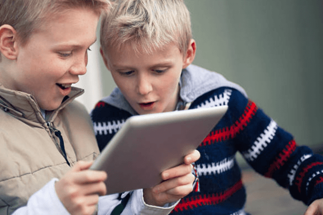 two kids learning in the tablet